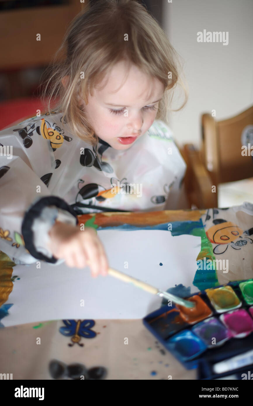 girl painting with watercolors Stock Photo - Alamy