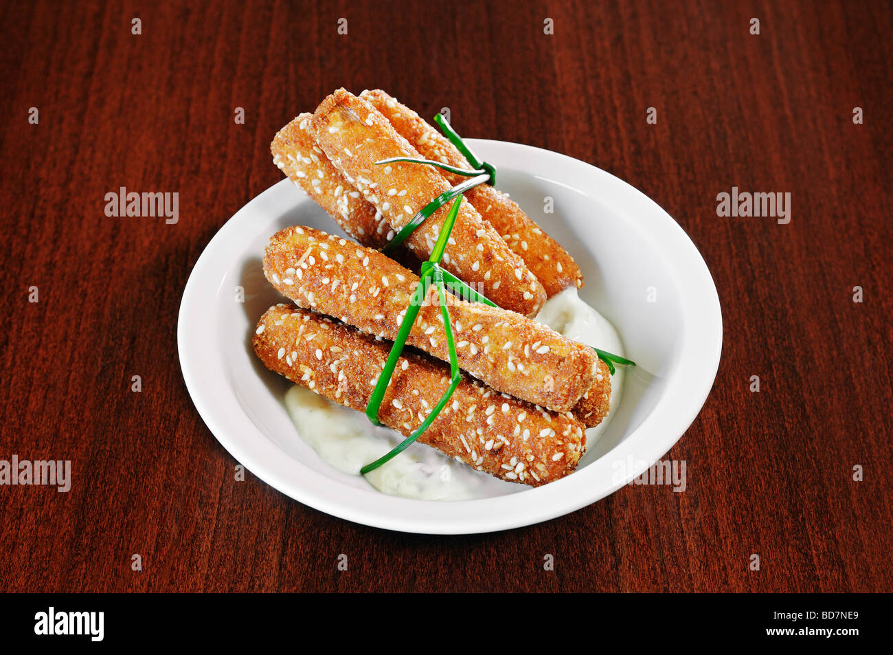 Vegetable Sticks with a Crispy Breadcrumb Coating Served with a Sour Cream and Mayonnaise Dip Stock Photo