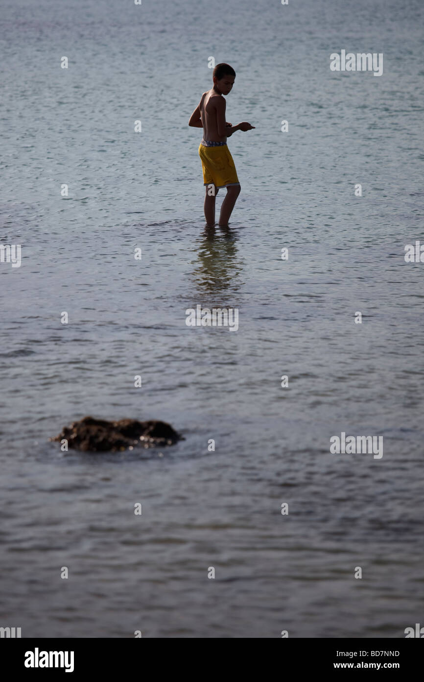 young boy in the sea Stock Photo