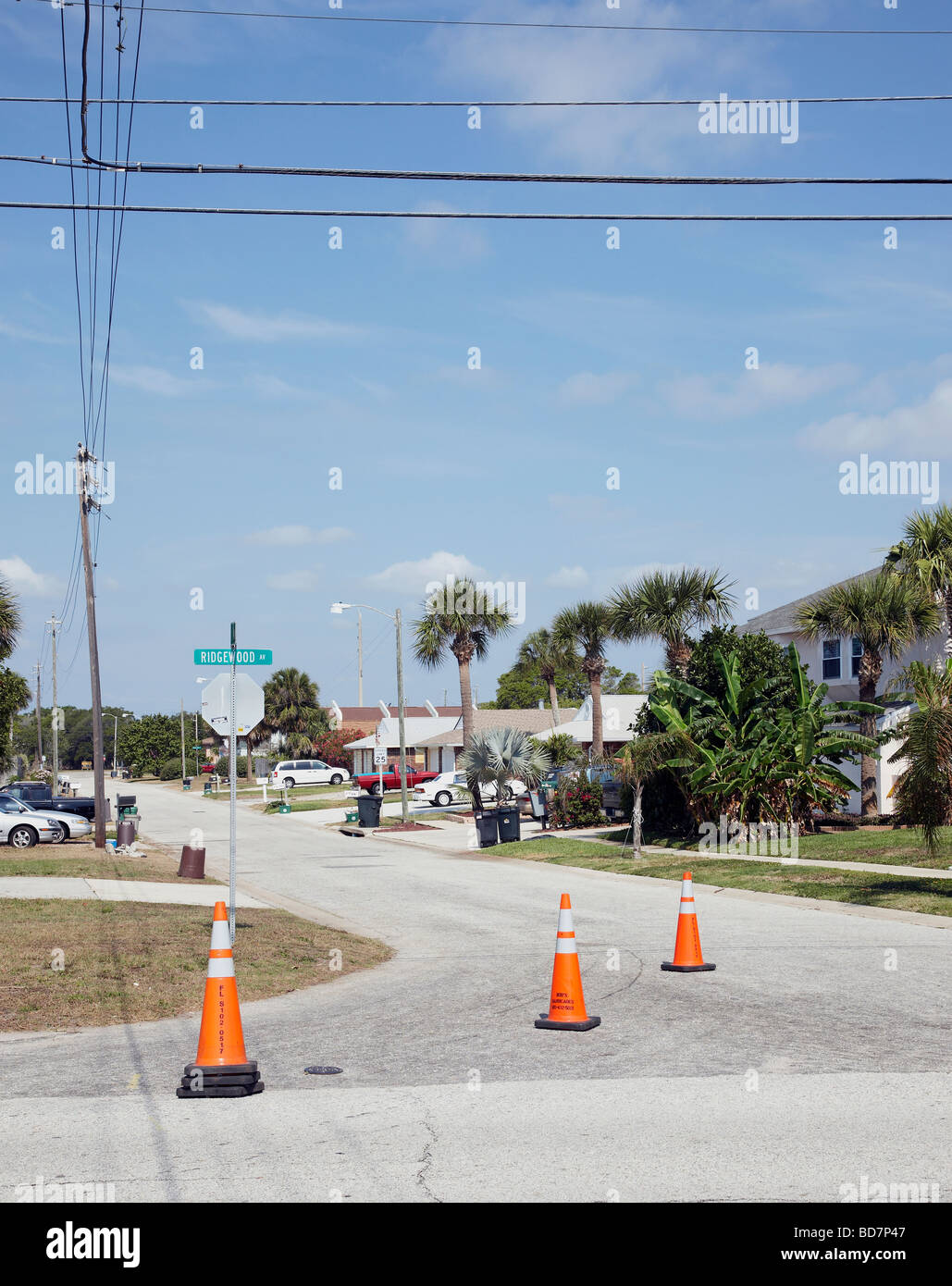 USA America American Florida Cape Canaveral cones traffic bollards warning safety block road drive sun blue sky orange Stock Photo