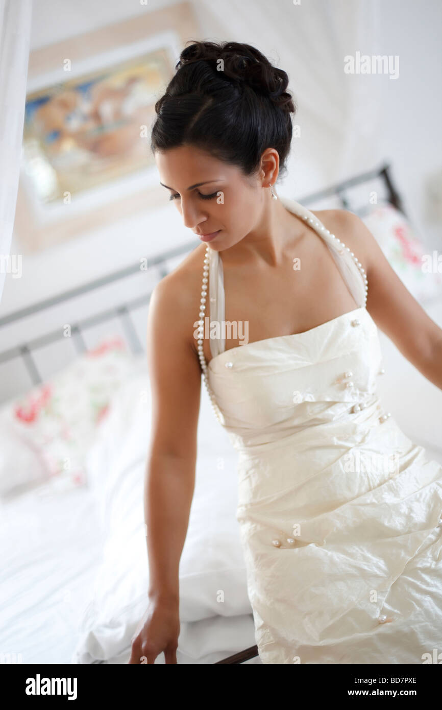 woman leaning on bed Stock Photo Alamy
