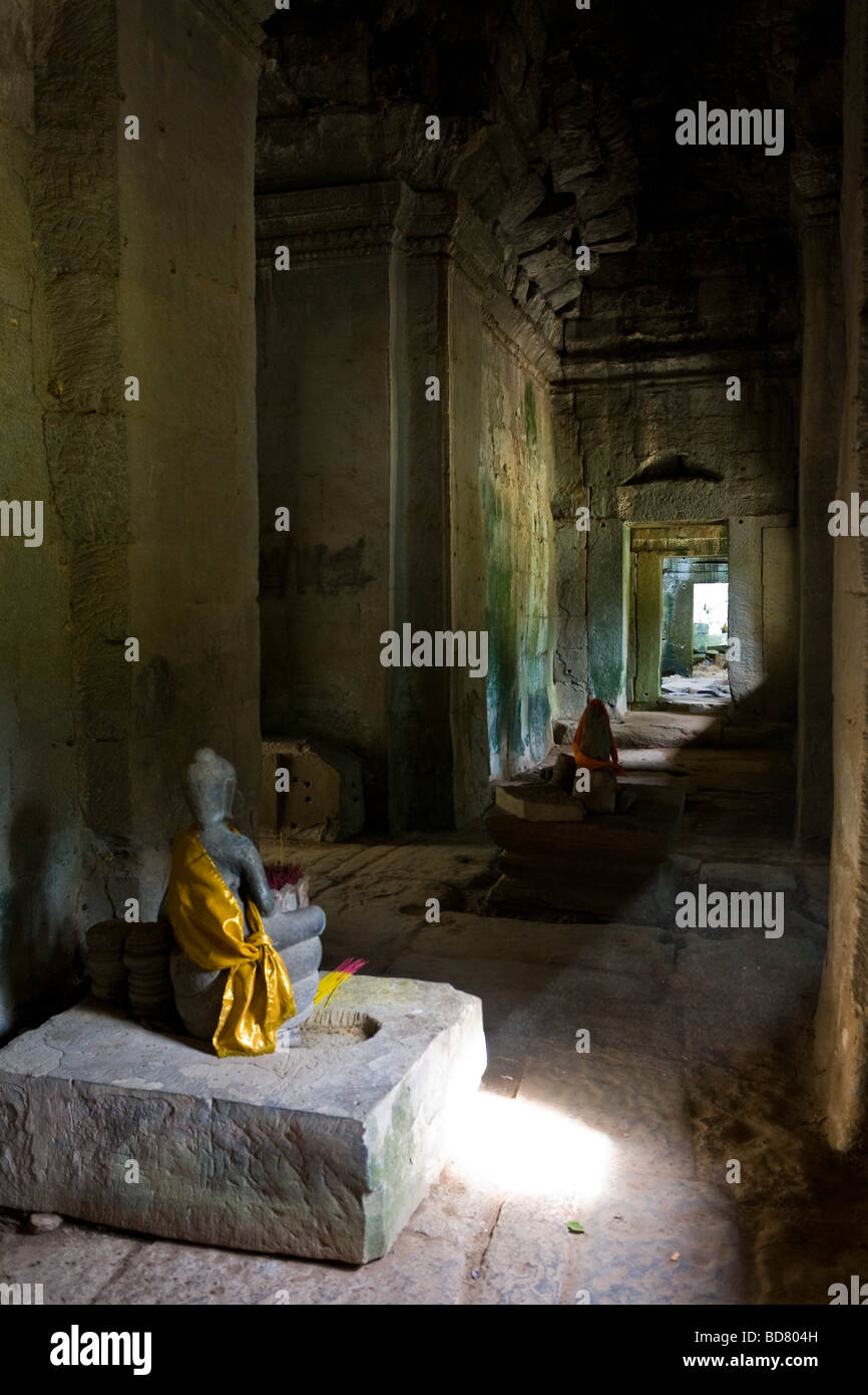 A Buddha statue in the Bayon temple of Angkor Thom Siem Reap Stock Photo