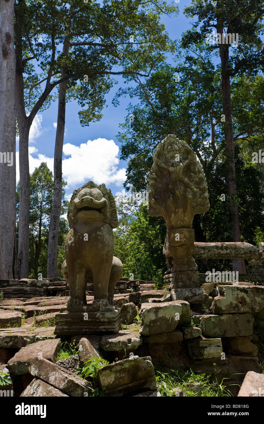 Carved stone lions and cobras guard a long-vanished doorway Stock Photo