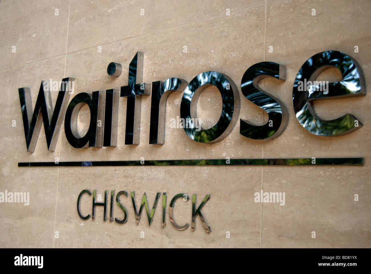 waitrose name and location, chiswick, on a branch of the supermarket on chiswick high road, west london, england Stock Photo