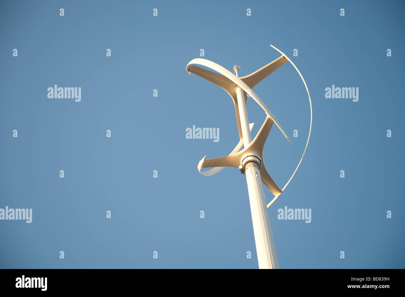 Wind turbine against a blue sky Stock Photo