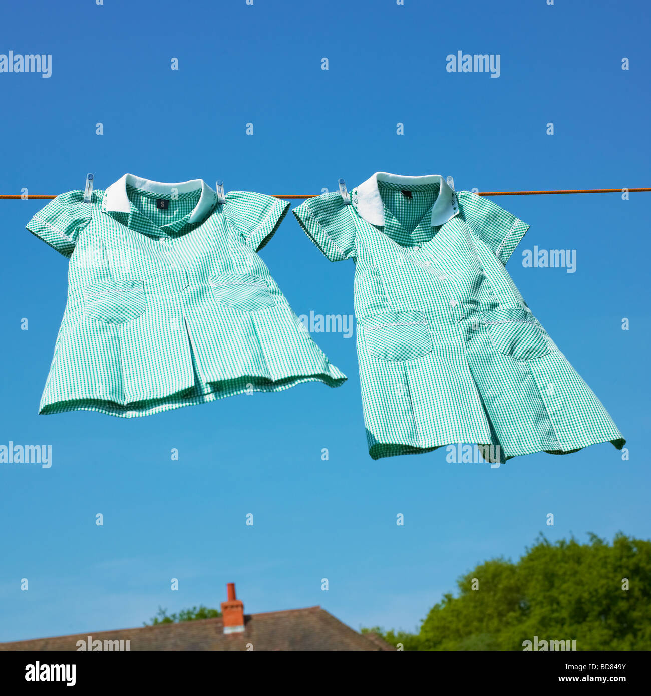 School uniforms on washing line Stock Photo Alamy