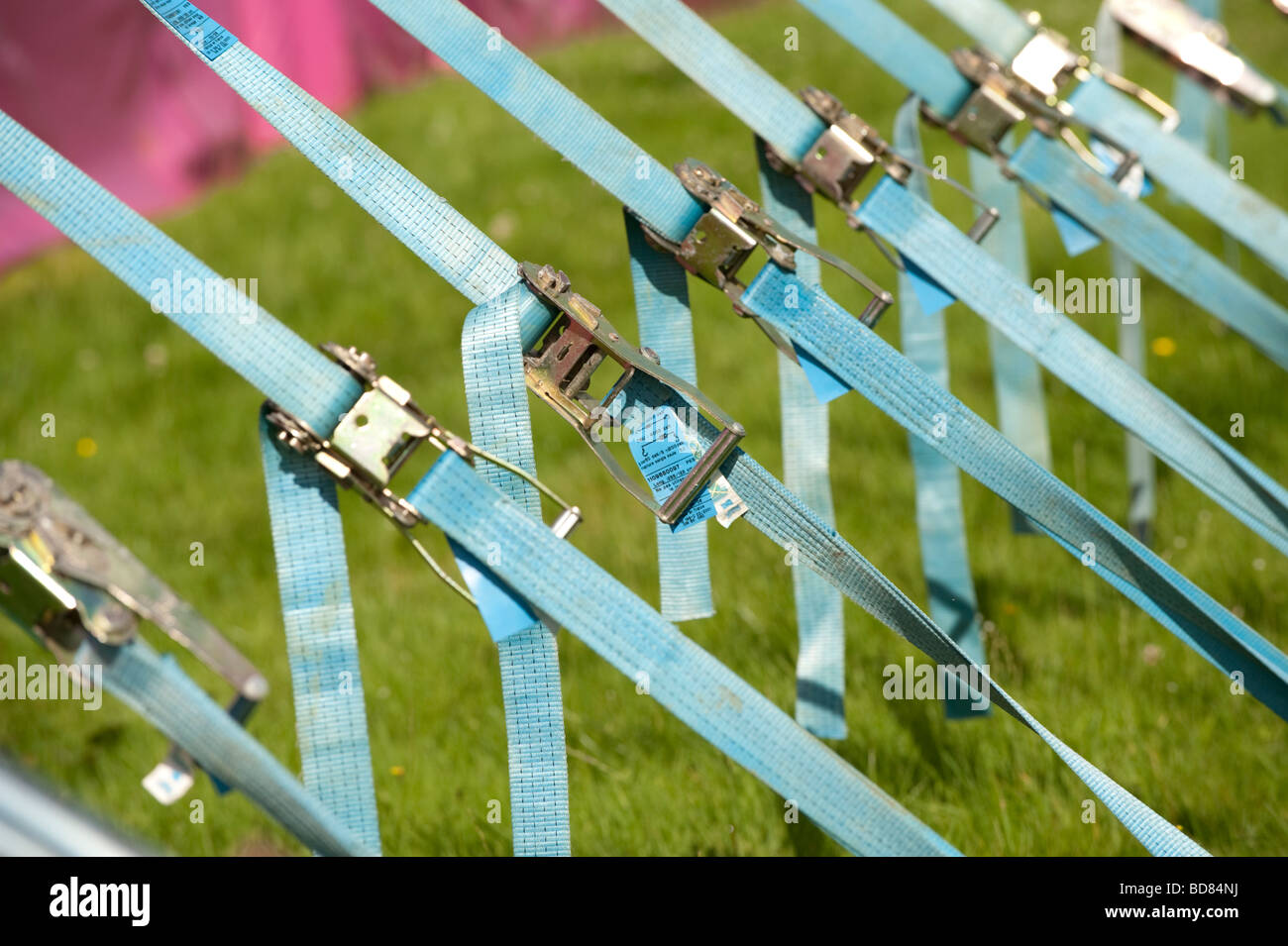 Row of tension tightening straps and pulleys on a large marquee Stock Photo