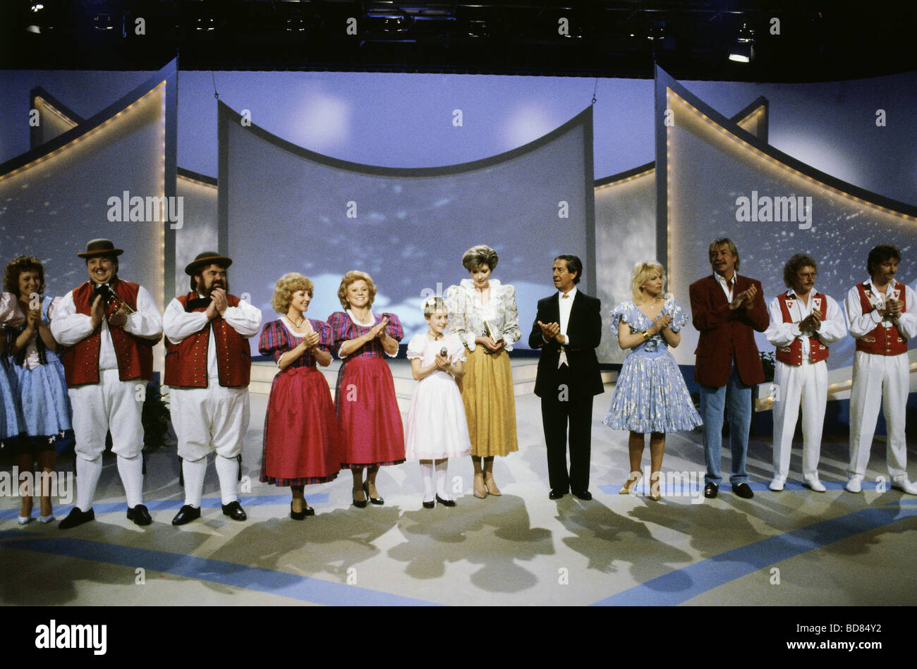 tv show 'Volkstümliche Hitparade im ZDF', DEU 1990, group picture with: Wildecker Herzbuben, Maria and Margot Hellwig, Stefanie Hertel, Carmen Nebel, Vico Torriani and others, Third-Party-Permissions-Neccessary Stock Photo