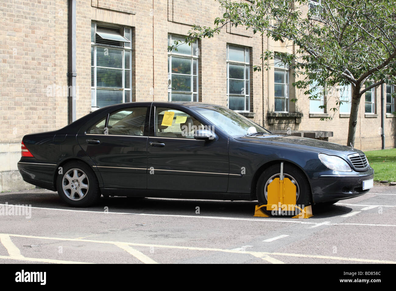 Car wheel clamped illegal parking hires stock photography and images