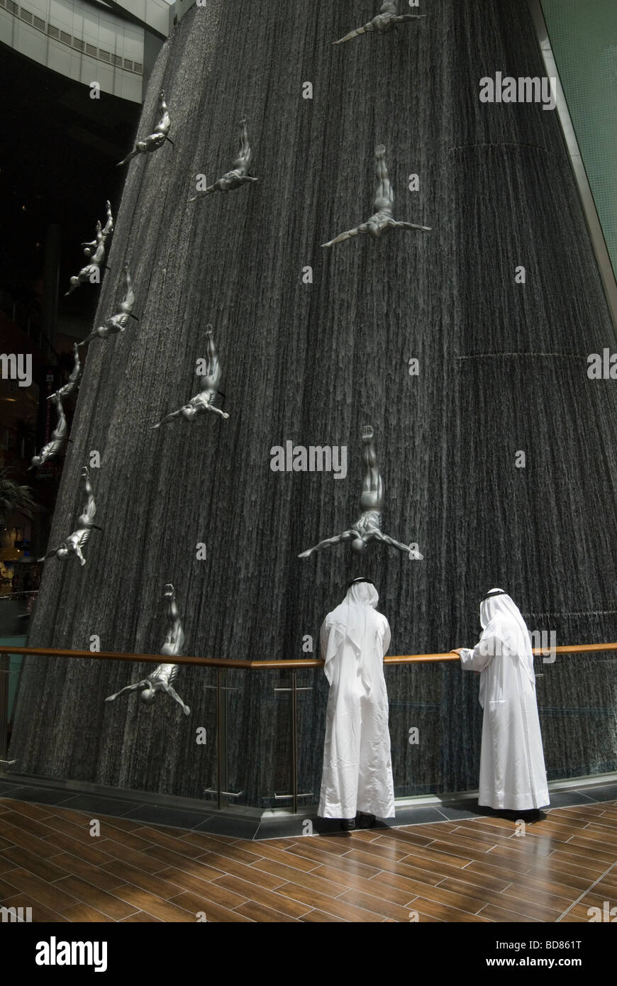 Arab men wearing a traditional thawb at The Dubai Mall Stock Photo