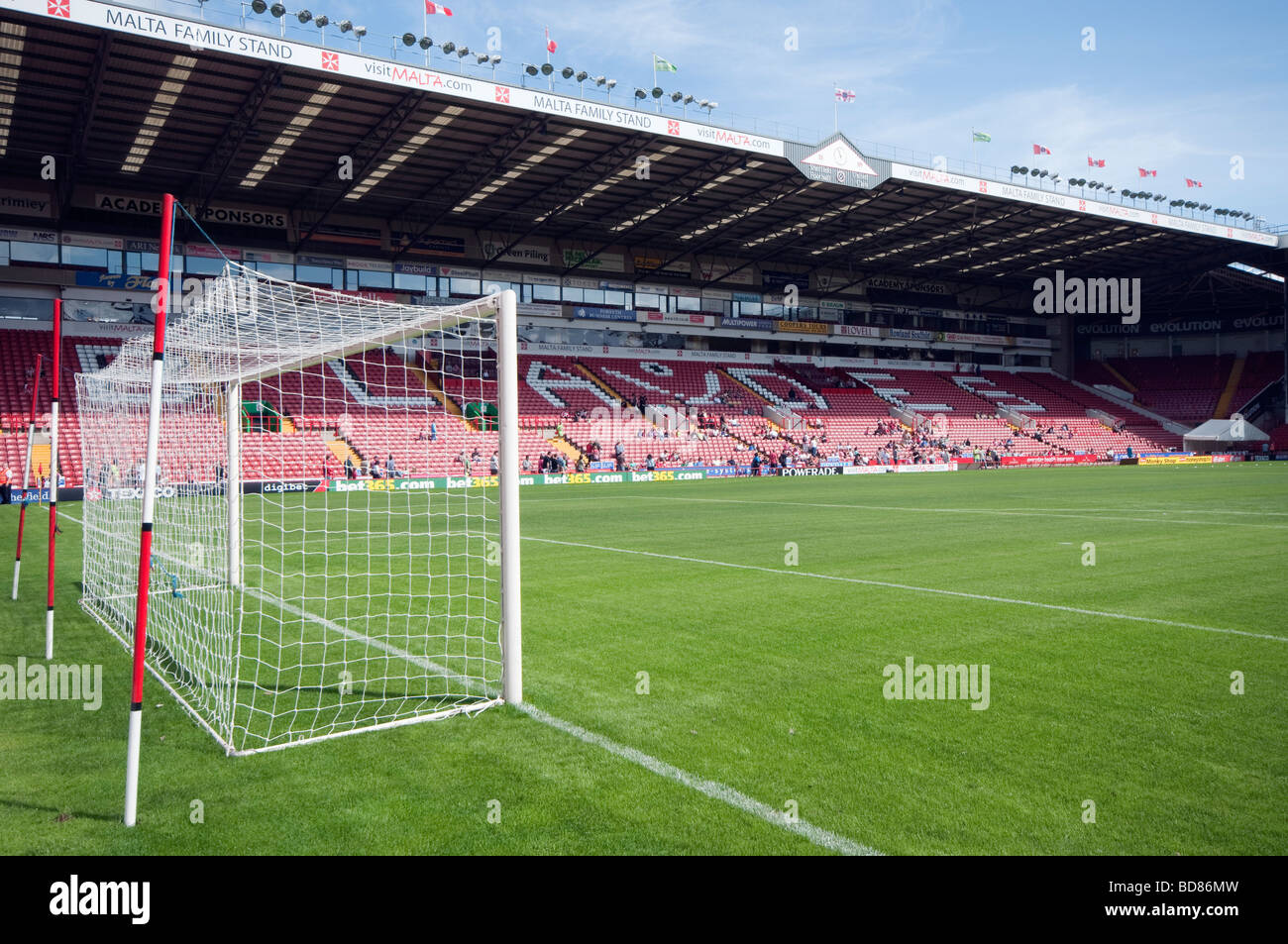 Goal, netting supports and stand  inside Sheffield United Football Club stadium Stock Photo