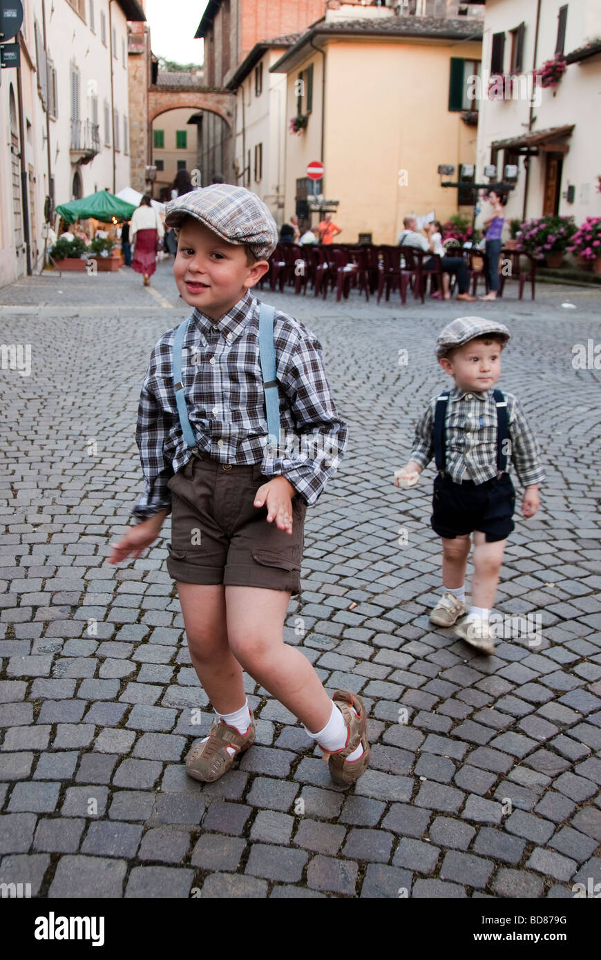 Italian children dressed in vintage clothing in a festival of bygone traditions in Sansepolcro Tuscany Stock Photo