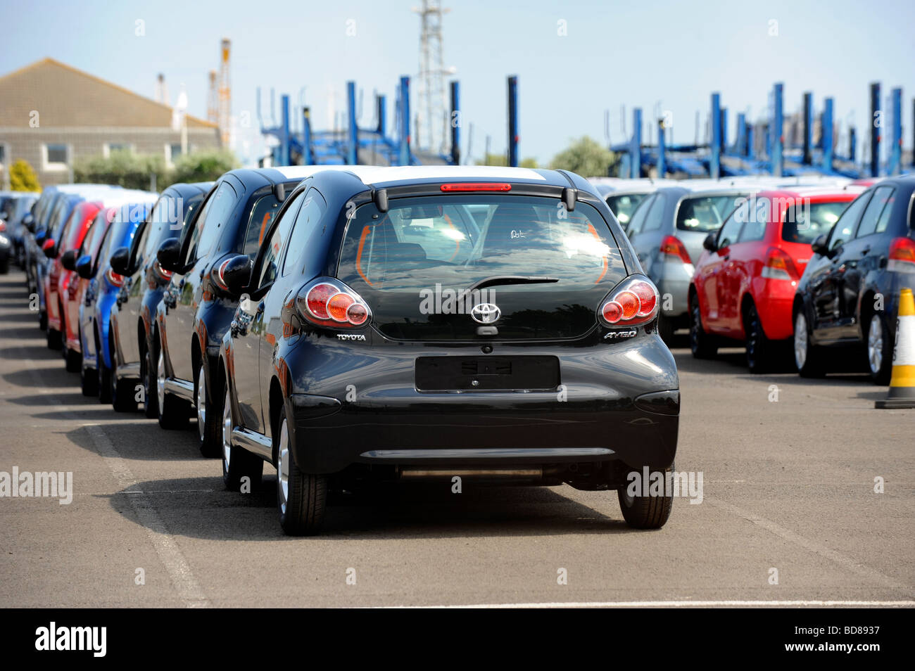 A row of brand new Toyota Aygo cars wait near grimsby docks  to be shipped off to garages round the country Stock Photo
