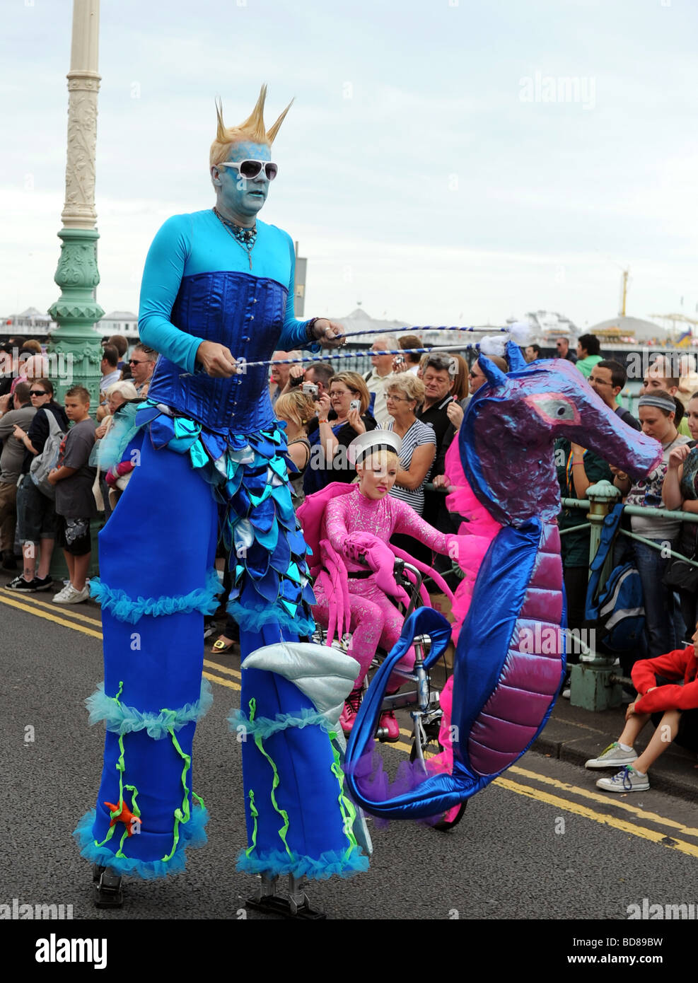 people in fancy dress taking part in this years Brighton Pride procession many in fancy dress or outrageous outfits Stock Photo