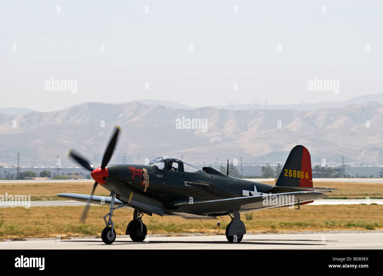 A P-63 Kingcobra taxis on the runway after flying at an air show. Stock Photo