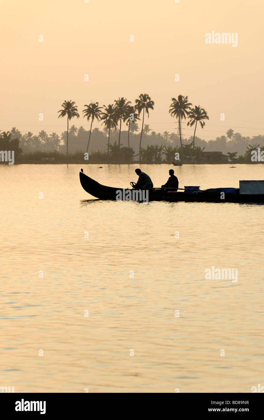 Silhouette of fishermen on a lake Stock Photo - Alamy