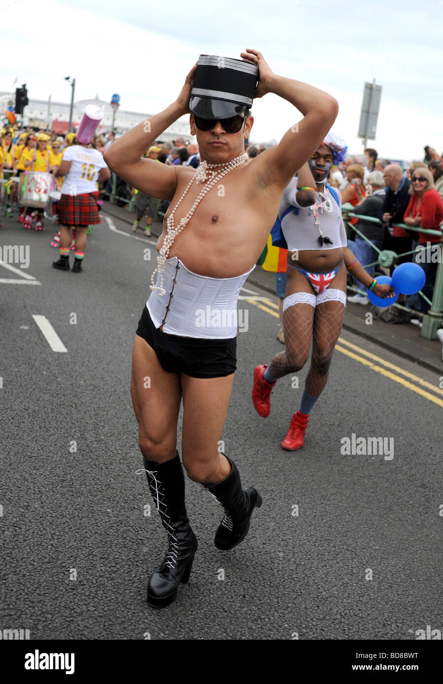 Characters taking part in this years Brighton Pride procession many in fancy dress or outrageous outfits Stock Photo