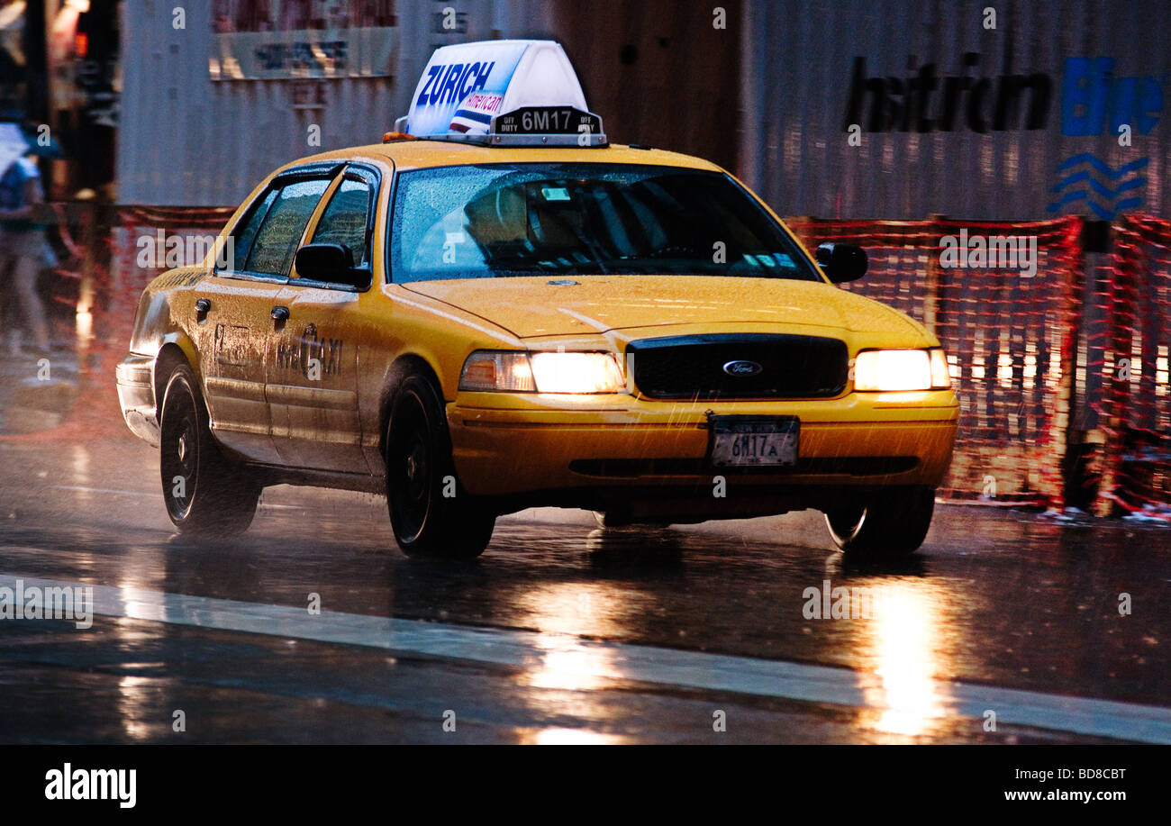 Yellow Cab at the street. Rainy day. Stock Photo