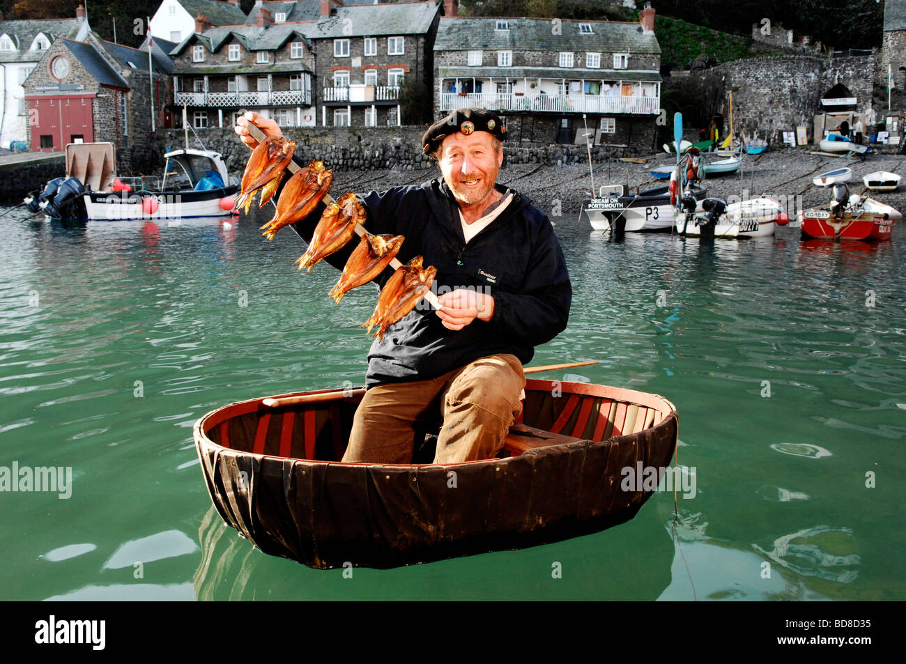 Fish smoker and maritime historian Mike Smylie in coracle with smoked