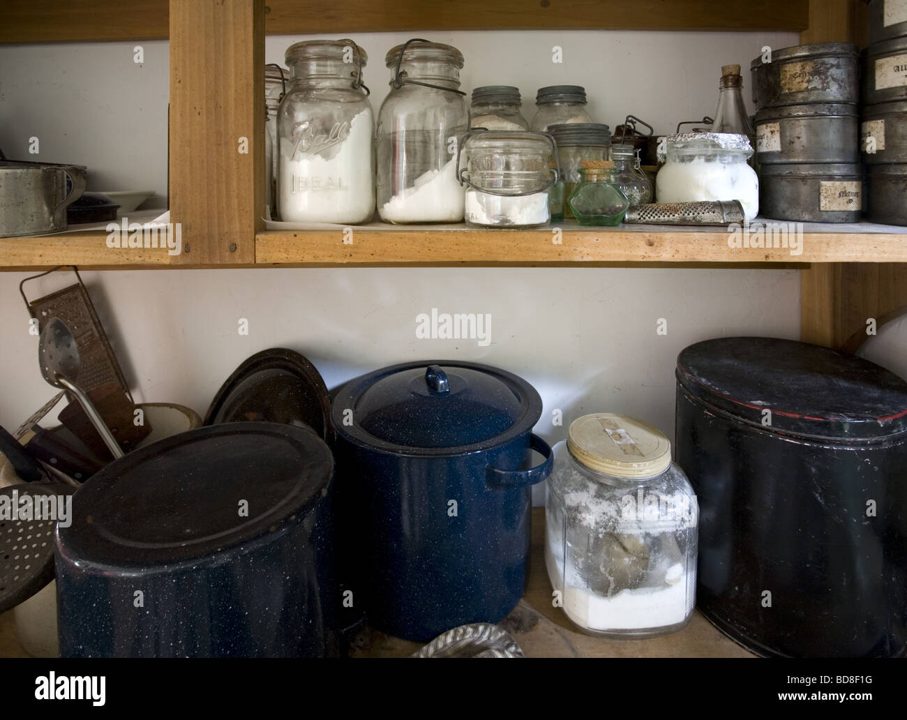 Cooking pots and ingredients in a farm summer kitchen Stock Photo