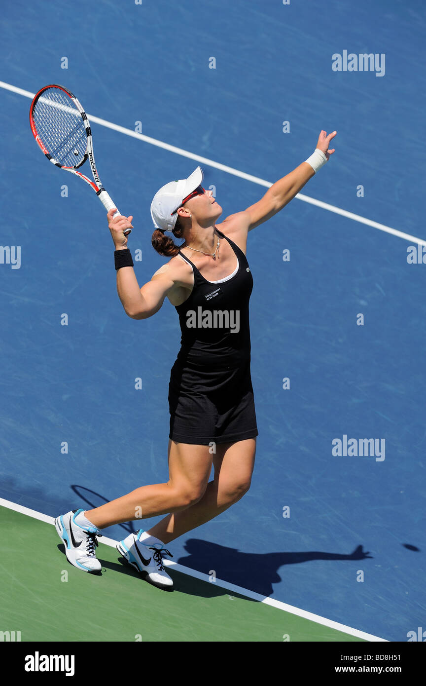 Samantha Stosur of Australia serves to Flavia Penneta during the Los Angeles Open Championship Singles Final. Stock Photo