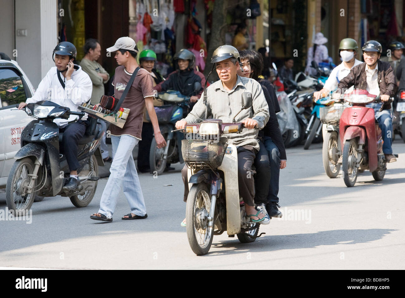People riding scooters/mopeds in Vietnam in Hanoi Stock Photo Alamy