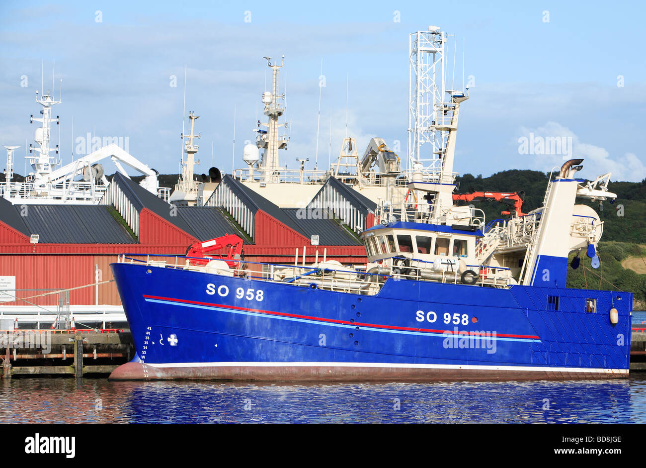 Blue fishing vessel in harbour Stock Photo Alamy
