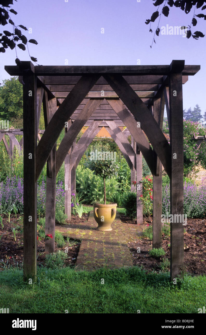 arched garden shade pergola on Private Garden Surrey Wooden Arch Pergola Stock Photo Alamy