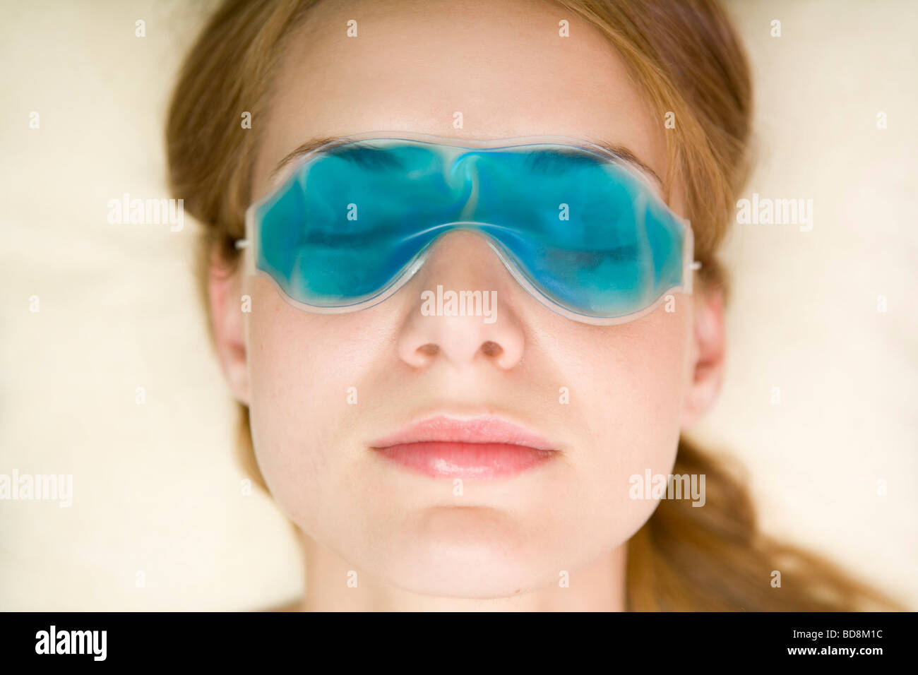 Young woman relaxing with gel eye mask on Stock Photo Alamy