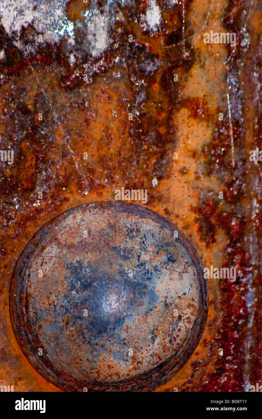 Corrosion patterns on riveted steel plate. Stock Photo