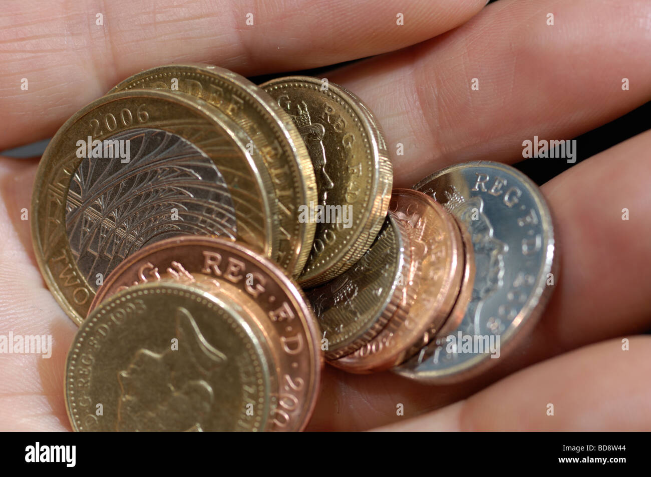 Close up of hand holding British change Stock Photo