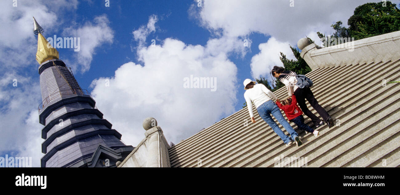 Family climbing the stairs to a tower Stock Photo