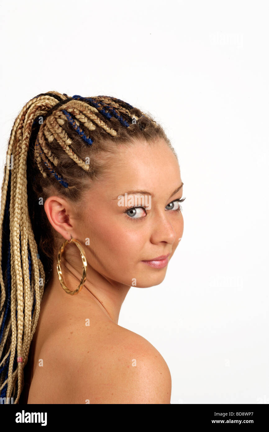 young woman with cat like eyes and braids in her hair Stock Photo
