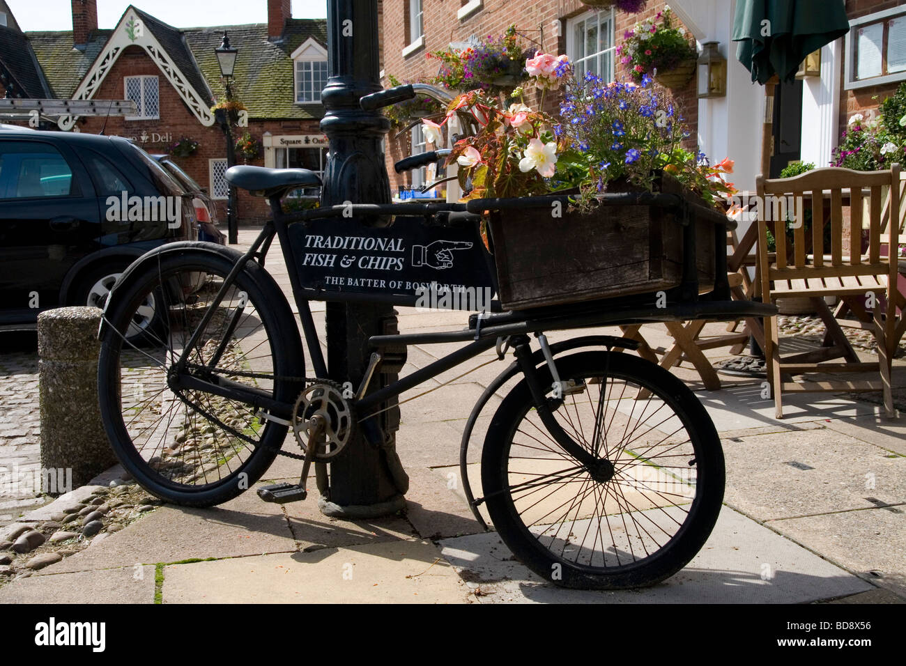 A fish and chip shop sign on a bike in Market Bosworth Stock Photo Alamy