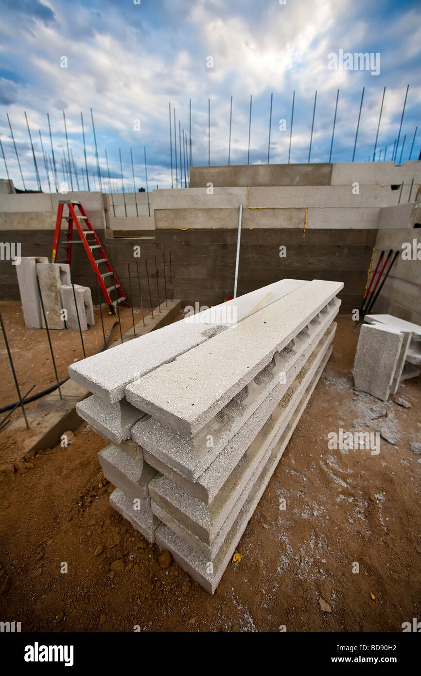 Recycled styrofoam and light wight concrete make up these building materials as block walls rise and a new home takes shape Stock Photo