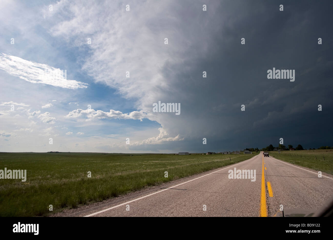 A highway in southern Kansas leads towards a developing supercellular storm June 4 2009 Stock Photo