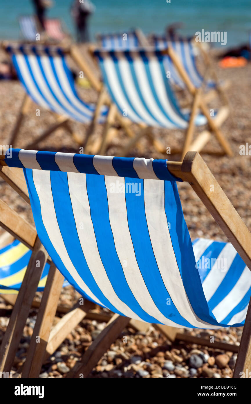 Brighton Britain England Holiday Staycation happy enjoy Summer Sunshine Hot beach Blue sky August deck chairs blue blue stripes Stock Photo