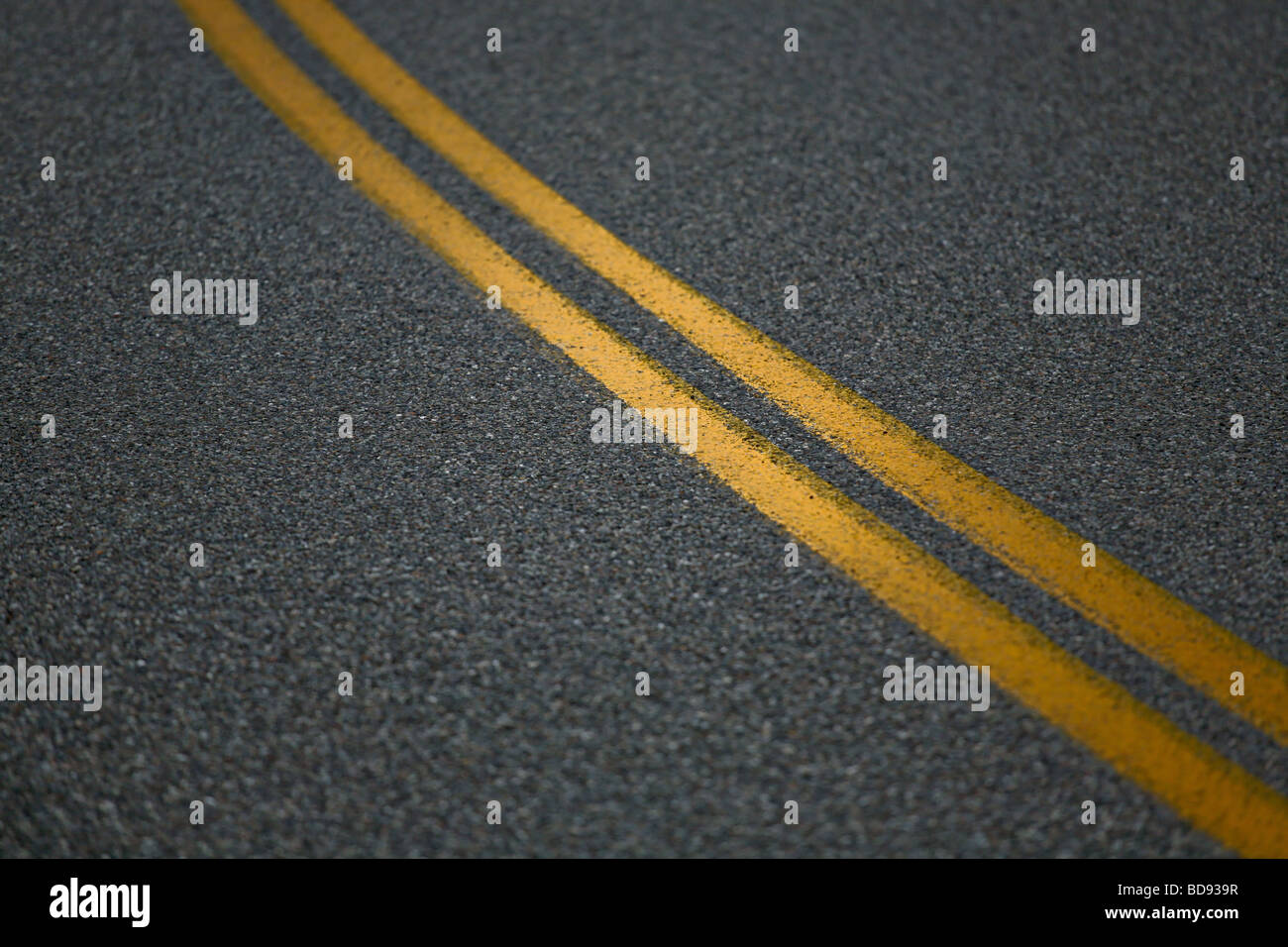 Double yellow lines on the paved road Stock Photo Alamy