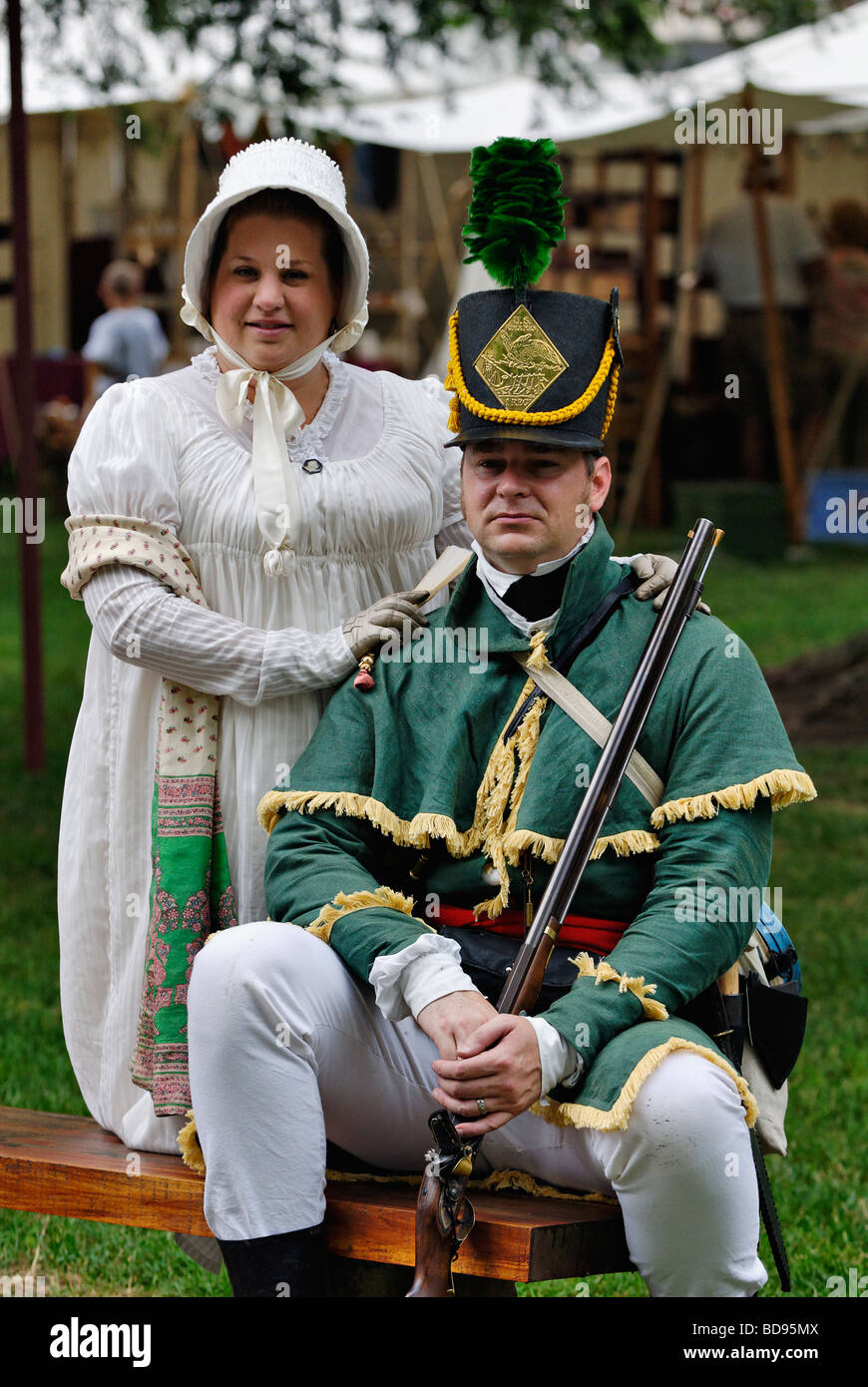 Couple in Early Nineteenth Century Costume Sitting at Encampment at Reenactment in Corydon Indiana Stock Photo