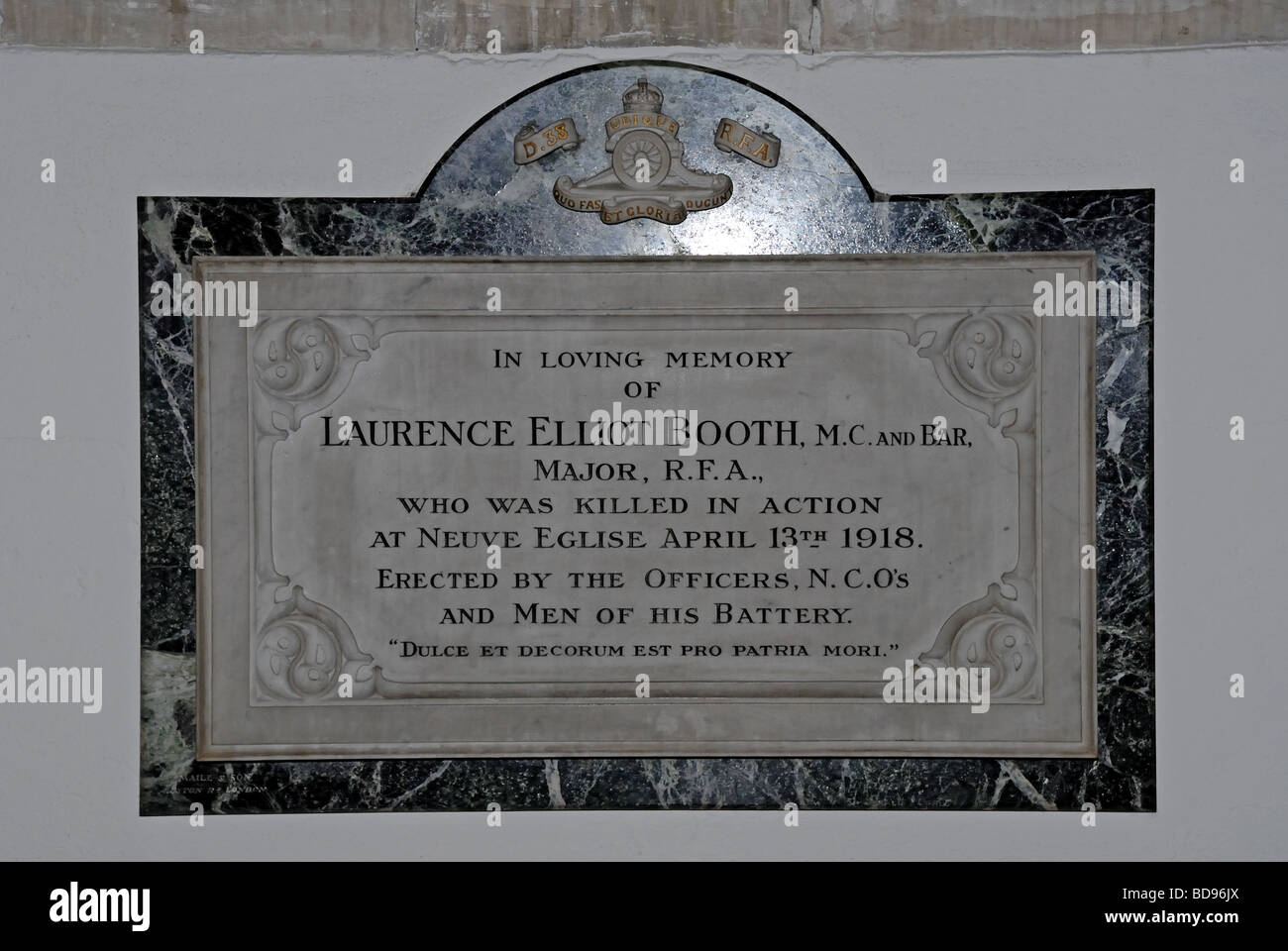 Plaque in memory of Major Laurance Elliot Booth M C and Bar in St Peter s Church in Old Woking Surrey England The church is a Stock Photo