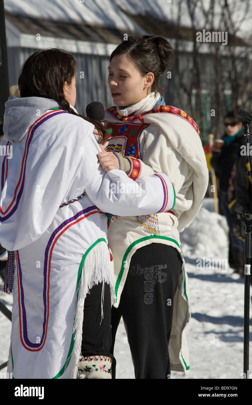 Two Women Throat Singing. Two young women dressed in native Inuit parkas perform a throat singing for the crowds at Winterlude. Stock Photo
