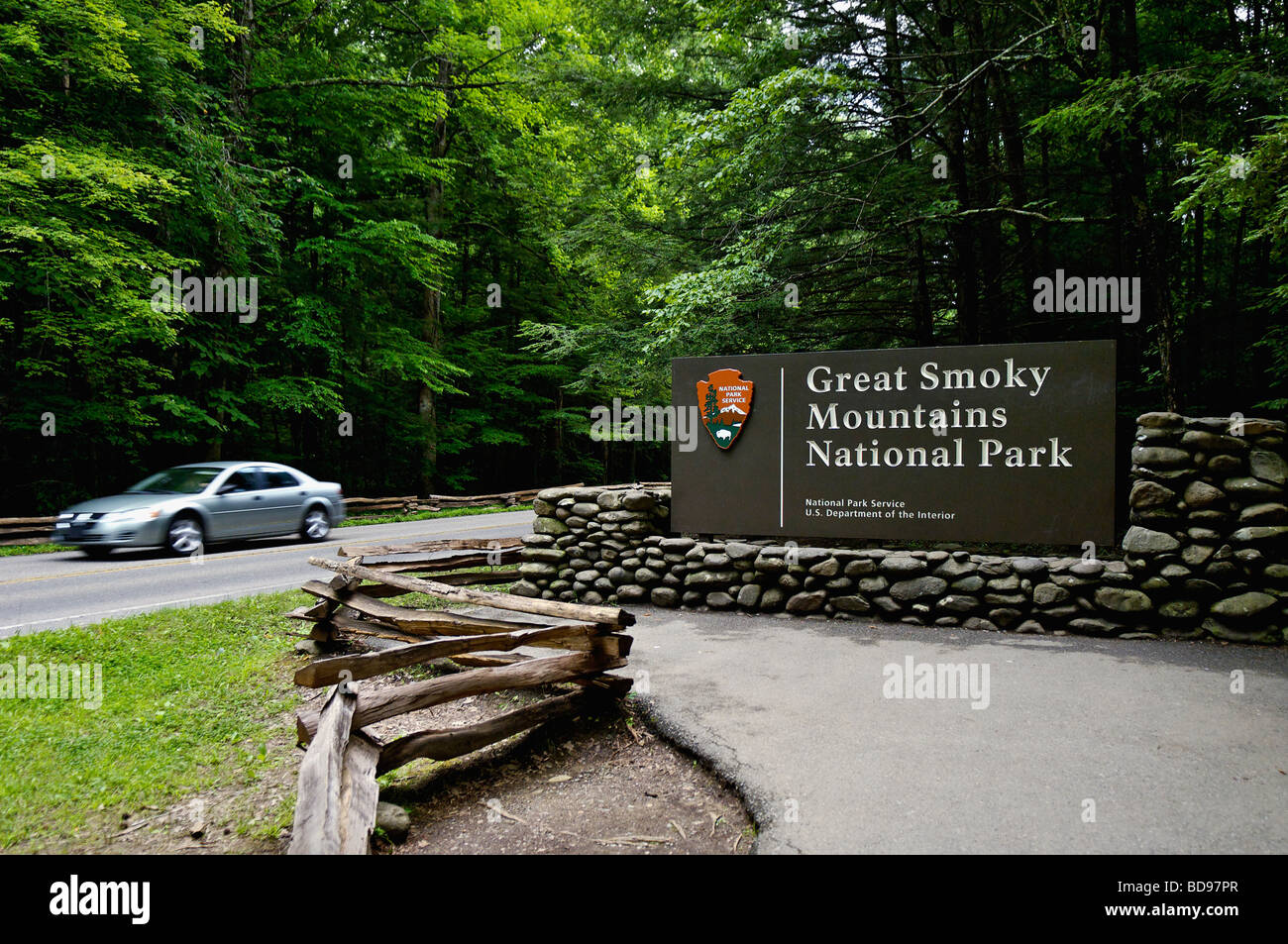 Car Driving Past the Entrance Sign to the Great Smoky Mountains National Park on Route 441 in Tennessee Stock Photo