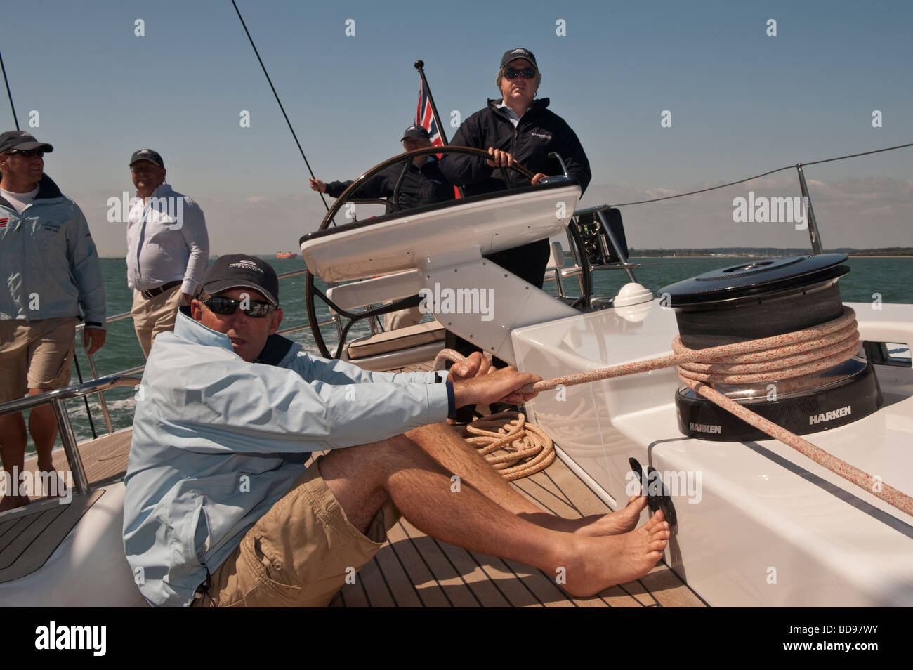Tacking across Southampton Water aboard sailing yacht Liara with her designer Bill Dixon on the wheel Stock Photo