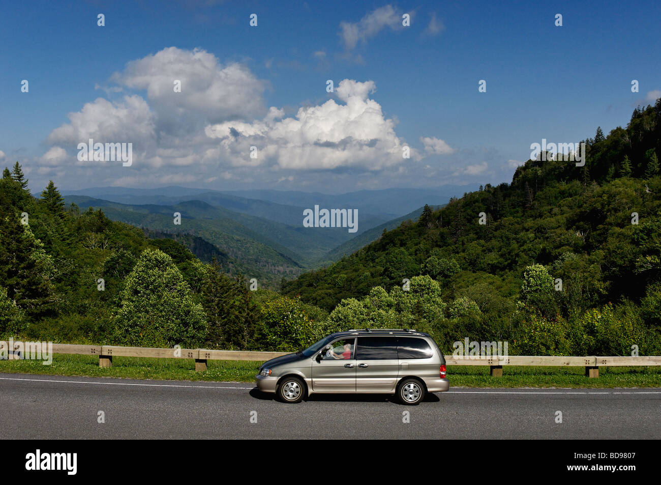 Minivan Driving Past View of the Great Smoky Mountains below Newfound Gap on Route 441 in North Carolina Stock Photo