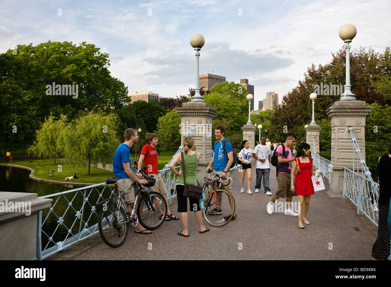 BICYCLISTS on a bridge in the BOSTON COMMON which is a public park and garden completed in the year 1837 BOSTON MASSACHUSETTS Stock Photo