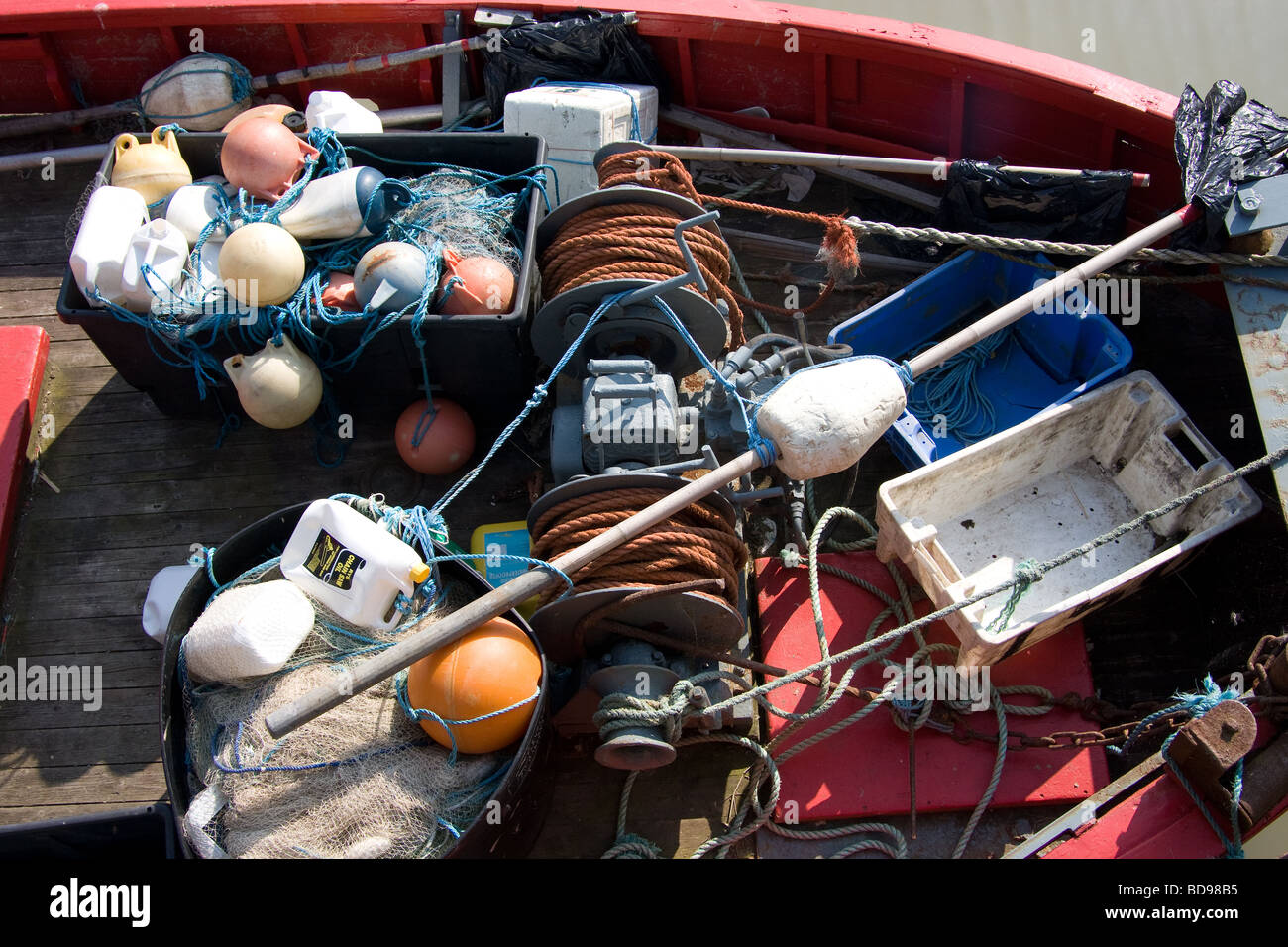 abandoned nets buoys winches short fishing boat  river tillingham east sussex england UK europe Stock Photo