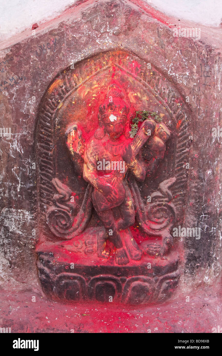 Bodhnath, Nepal.  Statue outside entrance to a Shrine adjacent to the Bodhnath Stupa. Stock Photo