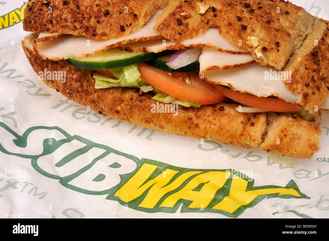 Subway turkey sub sandwich on wrapper with subway logo USA. Stock Photo