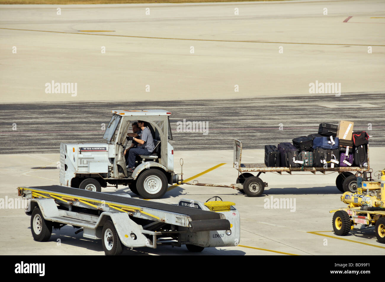 Baggage handlers at airport. Stock Photo