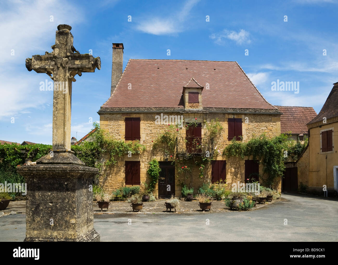 Village House and Cross Saint Leon sur Vezere Dorgogne France Stock Photo
